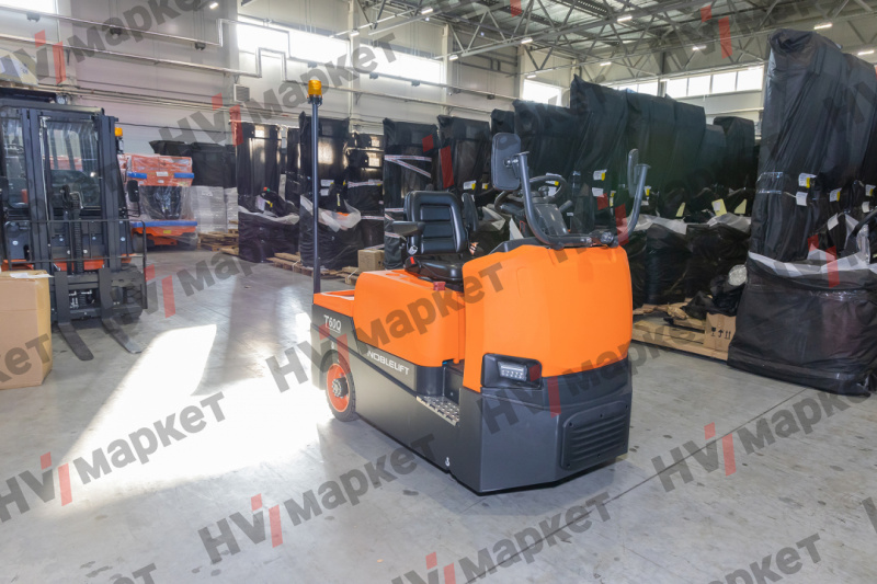 Самоходный Тягач для склада/производства Noblelift T60Q (Литий 300Ач + 150Ач, blue light and rearview mirror, walkie mode button, optional Controller Curtis F4A and display, Seat armrest), грузоподъемность 6000 кг, тип питания АКБ, напряжение 48 В